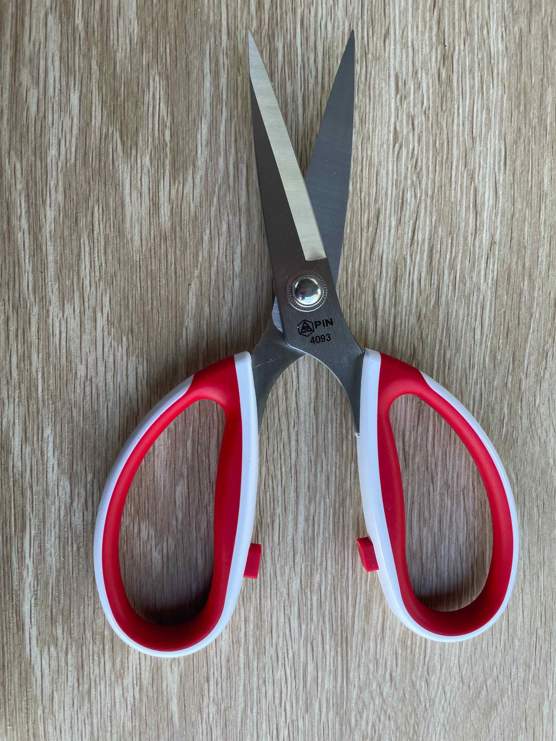 Front view of 4093PIN red and white handled fabric scissors